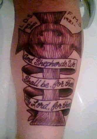  with the first part of the Family Prayer in the ribbon. Tattoo is of my 