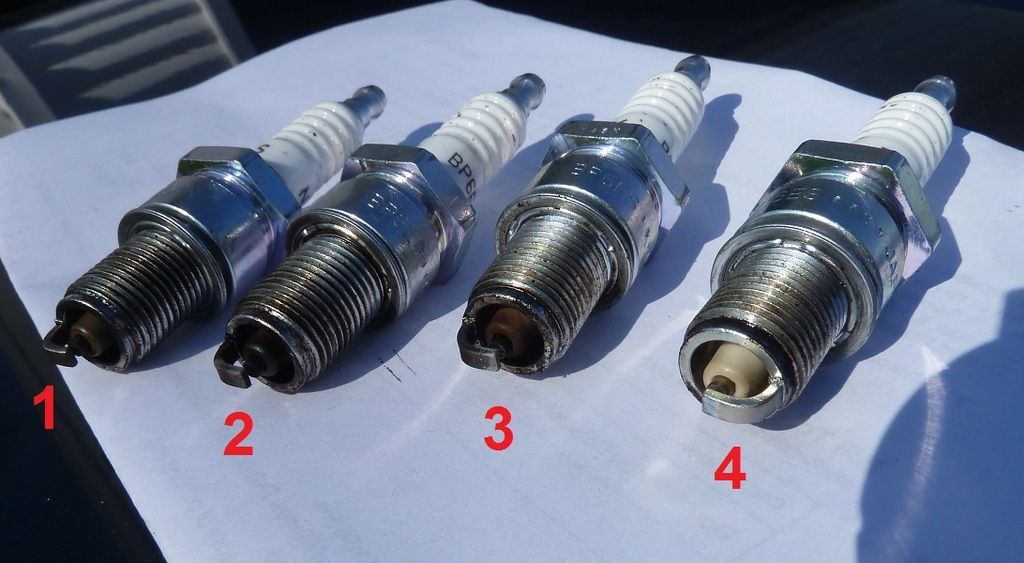 Backfire through carb, anything unusual with these spark plugs? MGB