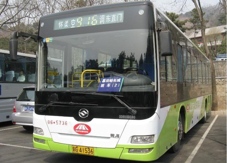 Buses with green livery are those that goes to rural places outside Beijing